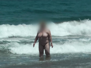 My wife naked on the beach